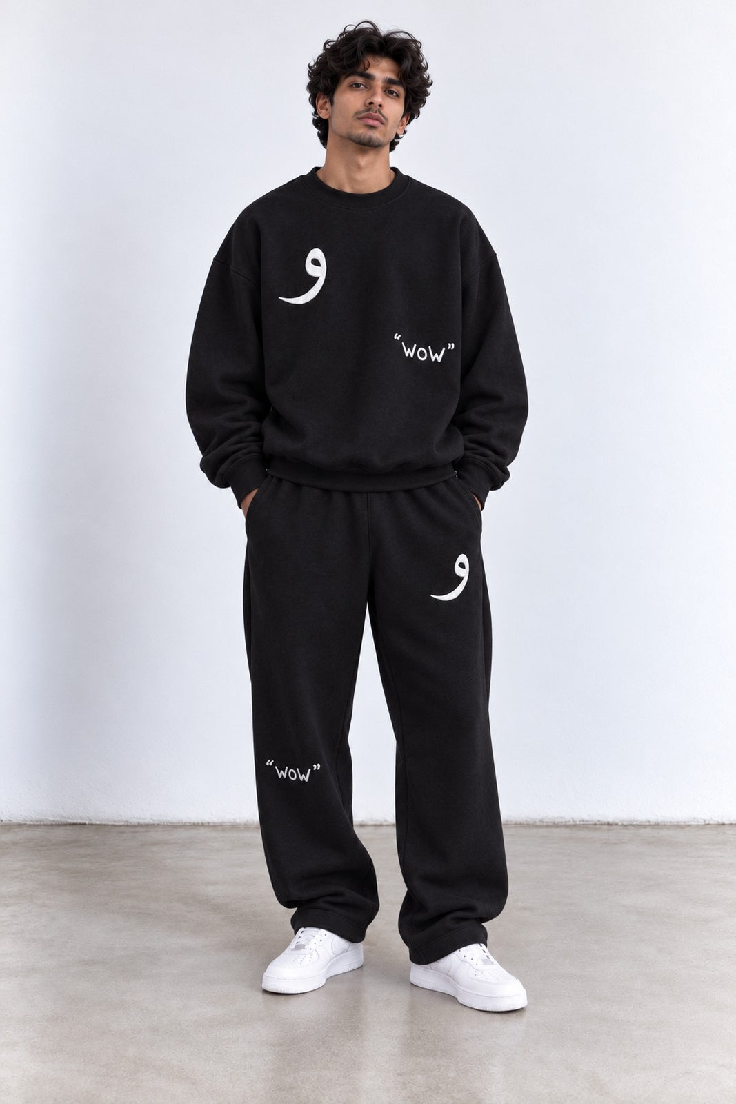 Classic Set in Black, front view with the Arabic letter on the chest and leg