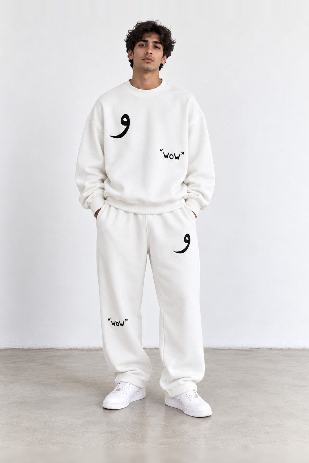 Classic Set in White, front view with the Arabic letter on the chest and leg