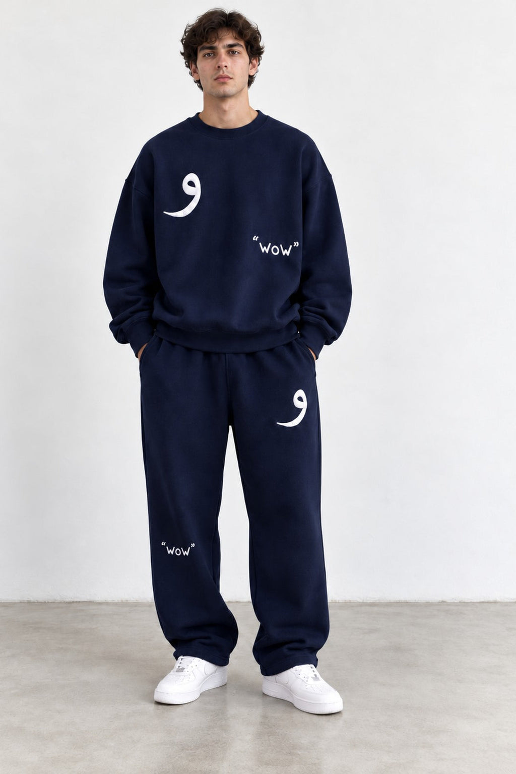 Classic Set in Navy, front view with the Arabic letter on the chest and leg
