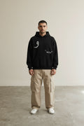 Full body view of the model wearing Classic Hoodie Black