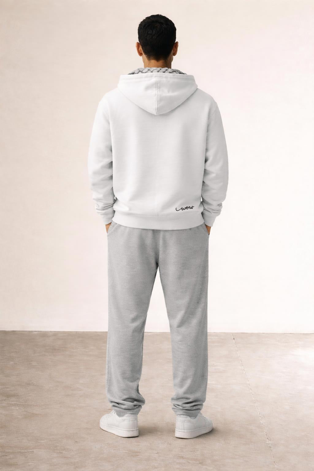 Back pose of the model wearing Keffiyeh Hoodie White
