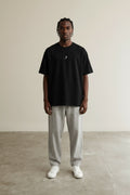 Full body view of the model wearing Mini Logo Tee Black