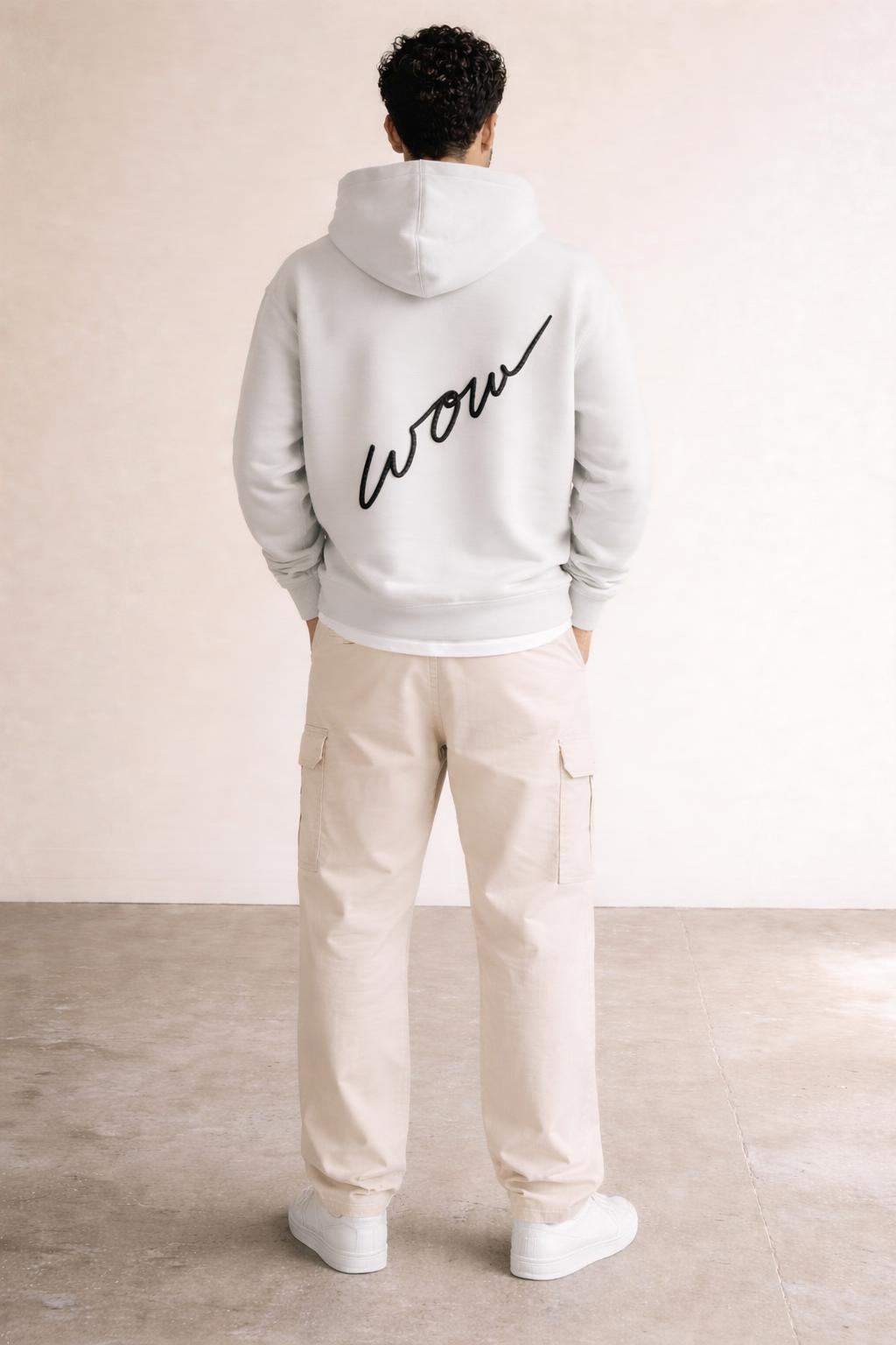 Back pose of the model wearing Box Logo Hoodie