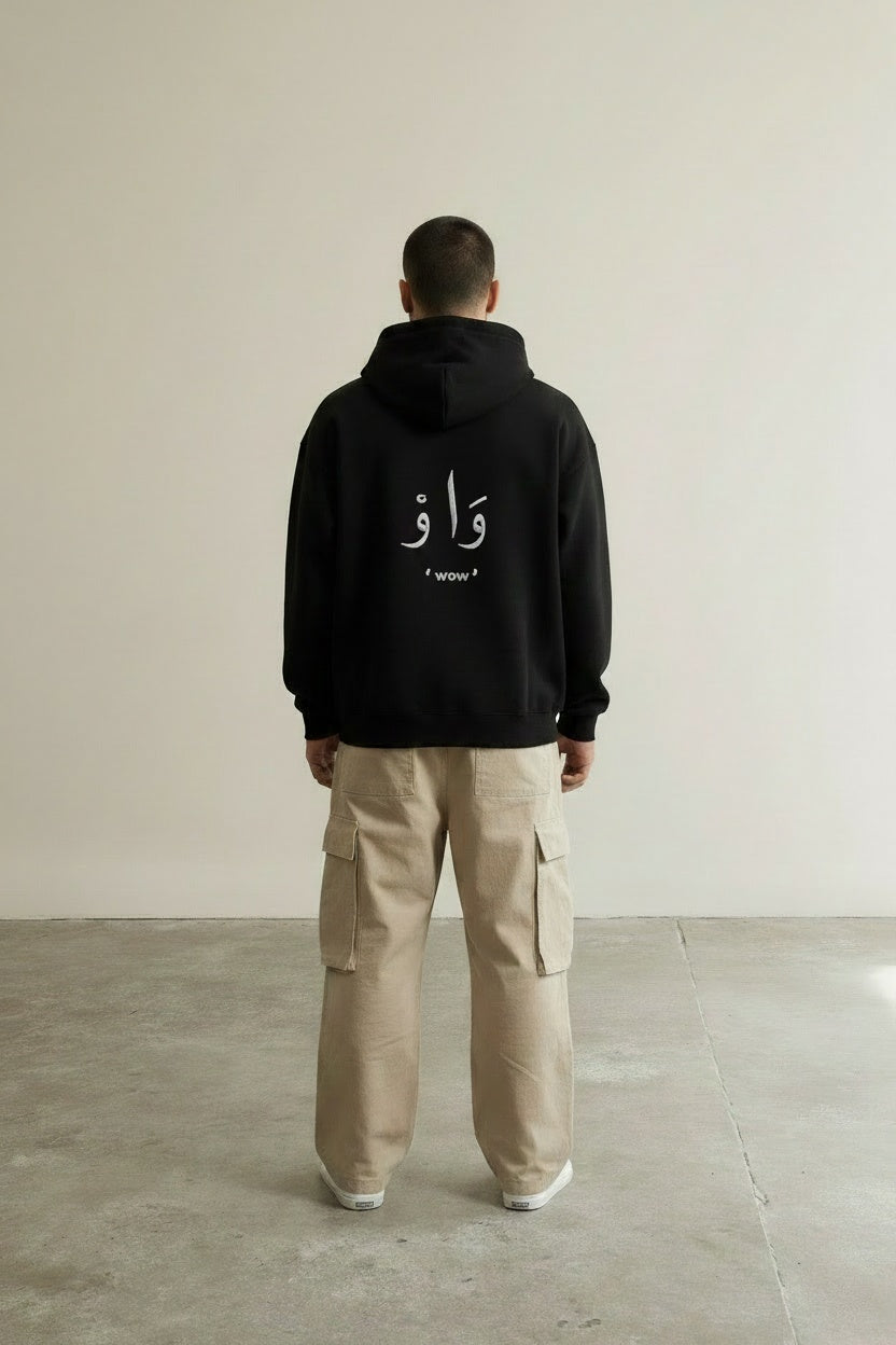 Back pose of the model wearing Classic Hoodie Black