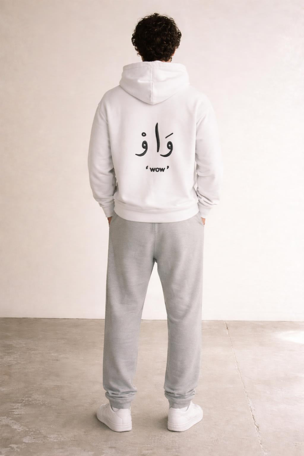 Back pose of the model wearing Classic Hoodie White